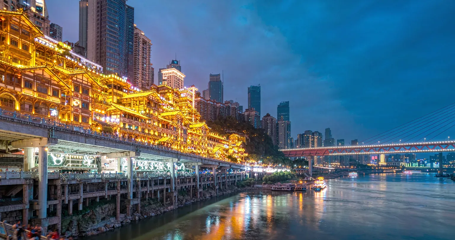 Hongya Cave &mdash; golden stilt-houses above the river